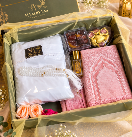 HAADIYAAS Premium Cotton Prayer Gift Hamper with white cotton prayer dress, pink prayer mat, tasbeeh, attar, dates and chocolates